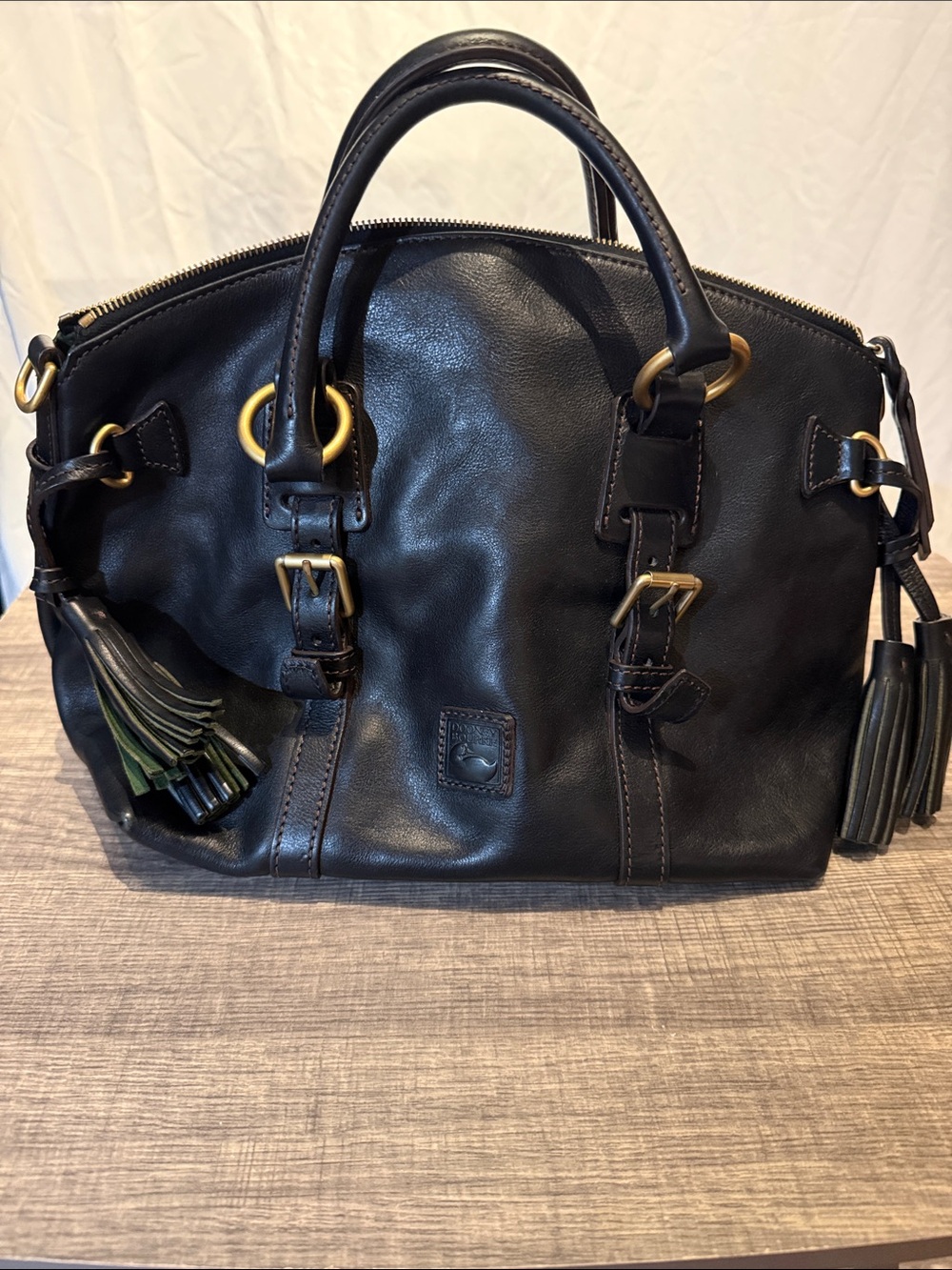 Dooney & Bourke Black Leather Satchel with Tassels and Gold Hardware